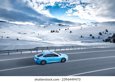car driving on the road of snowy winter. road landscape in snowy mountain. it's nice to drive on snowy mountains. Road view on the snow on the highway to winter holiday. Europe trip on nature scenery.