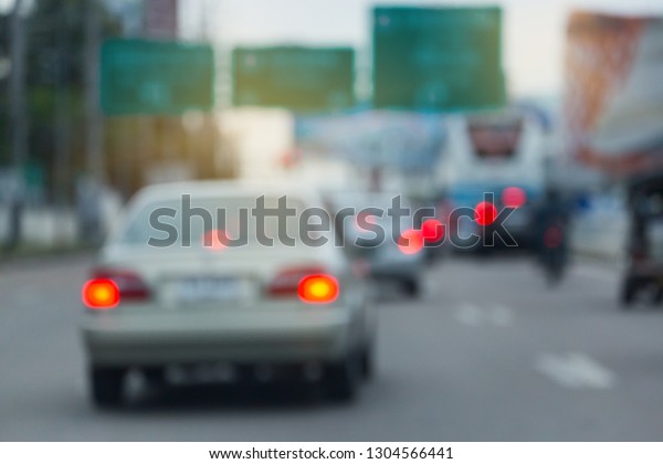 car driving\
on urban road, image blur\
background