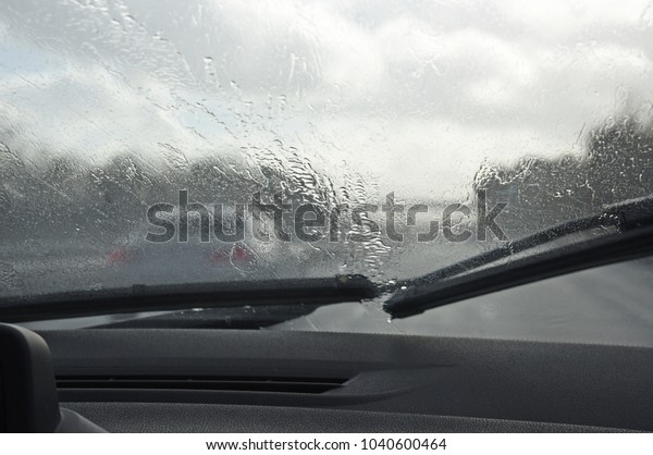 car driving in the\
rain