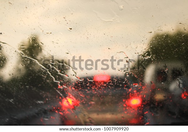 Car\
driving in a rain storm background.traffic\
jam