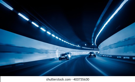 Car Driving Through Tunnel