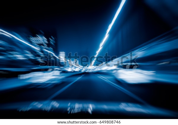 car driving through\
tunnel at night\
