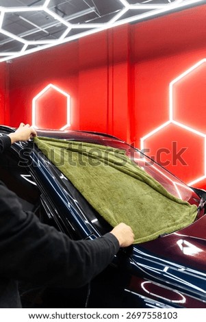 Car Drying Stage. Using soft microfiber towel for drying without damaging paint. Manual car drying for leaving no water stains on the paint of car in detailing