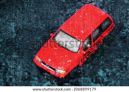 Car during the rain drowns in a huge puddle formed on street as a result of the flood. Photo effect: drops water on window glass