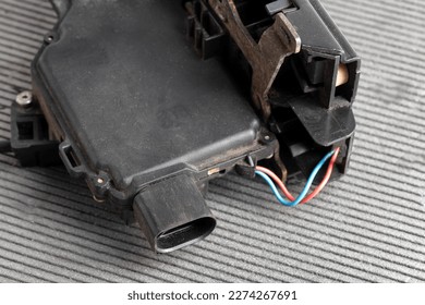 Car electric door lock, close-up. Limit switch failure, automotive part. Car electrical repair