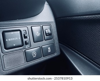 Car electronics control panel closeup with selective focus
