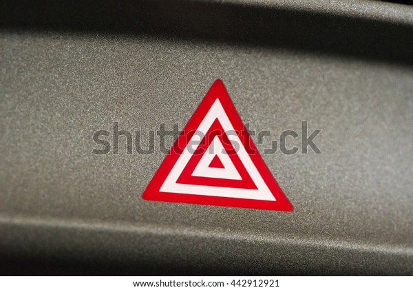 Car\
emergency attention light button in red\
triangle