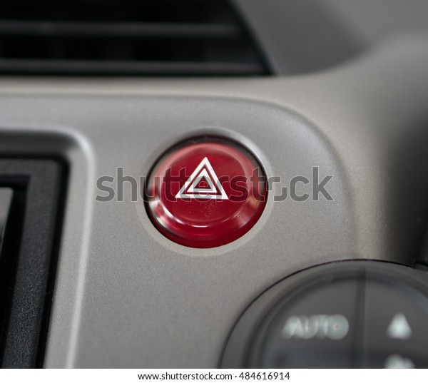 Car emergency lights\
button,emergency button in car, hazard light.Selective\
focus.\
