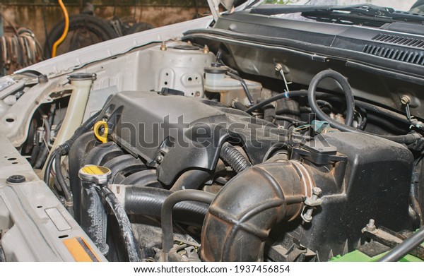 Car Engine or Auto Engine and Air Filter and\
Brake Fluid Reservoir and Car\
Part