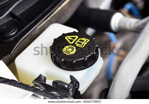 Car engine brake\
fluid container close-up