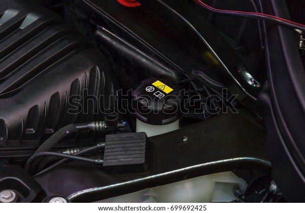 Car engine brake\
fluid container close-up, Car maintenance and check the level of\
brake and clutch fluid.