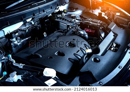Car engine. Engine compartment of a modern car. Open hood automobile.