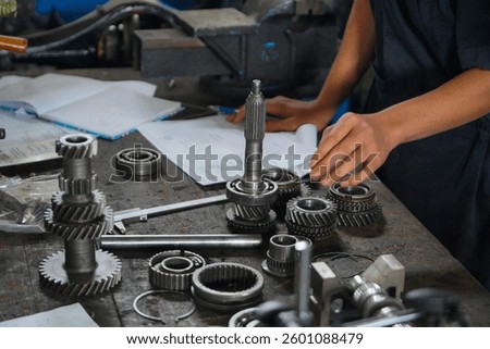 car engine components on display as training for automotive students.