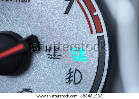 car engine cool light on car dash board meter gauge driver warning to wait warm heating engine