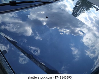 Car Engine Hood With Many Hail Damage Dents Show The Forces Of Nature And The Importance Of Car Insurance And A Replacement Value Insurance Against Stormy Weather And Storm Hazards Or Extreme Weather 