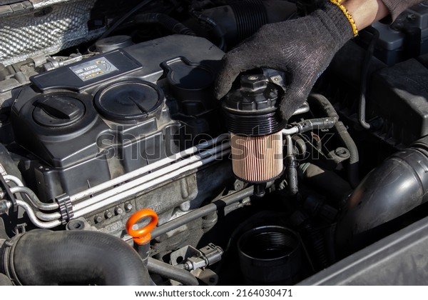 Car engine oil filter replacement.\
Transmission and maintenance. Energy fuel\
concept.
