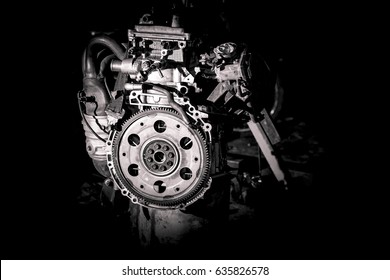 Car engine in open position in a workshop