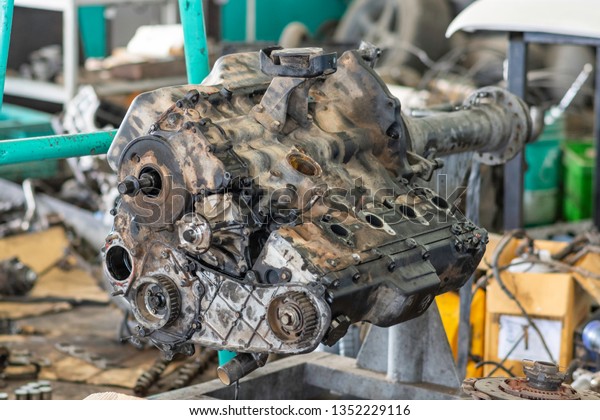 Car engine in open
position in a workshop