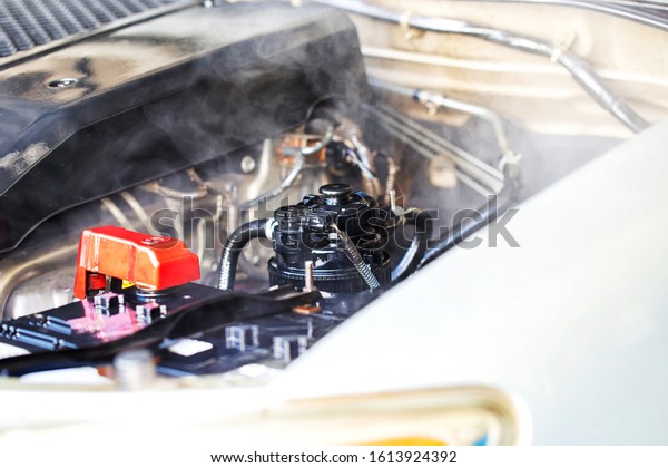 Car engine over heat. Overheated car machine\
Broken down with smoking.