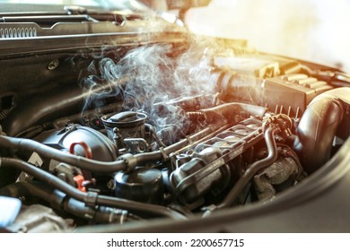 car engine overheating close up. vehicle engine in smoke. smoke or steam from a vehicle engine - Shutterstock ID 2200657715