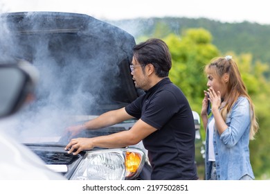 Car Engine Overheating, Smoke Out From Engine Front Hood Man Help To Check With Shocked Woman Driver