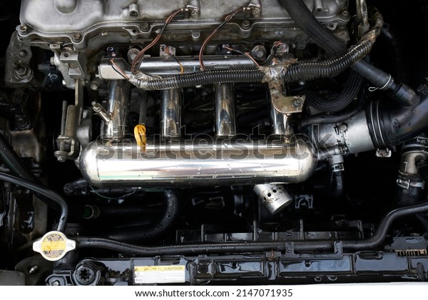 Car engine part. Close-up\
image of an internal combustion engine , Close up detail engine\
cars