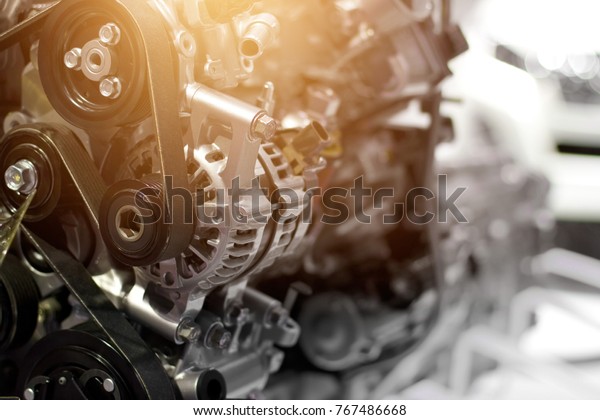 Car engine part, concept of modern\
vehicle motor and cut metal car engine part\
details