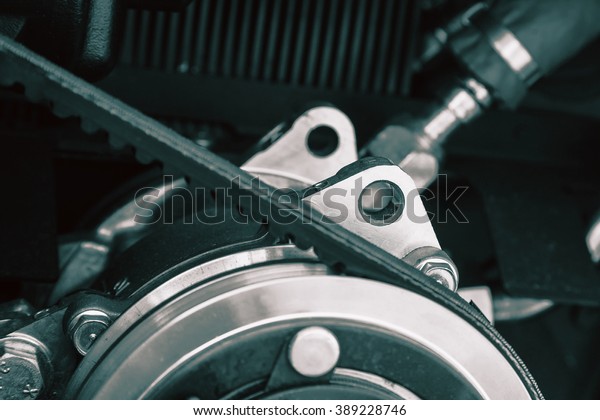 Car engine part. Selective focused. Detailed\
view of the engine and\
V-string.