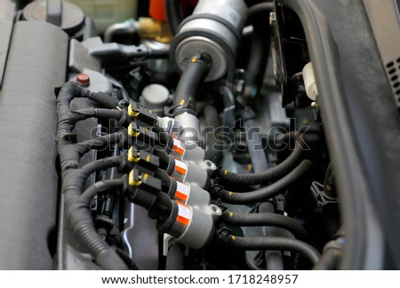 Car engine sequential gas injection. lpg car injectors in car engine need to service, gas injector installed in gasoline engine to use cheaper alternative fuel.