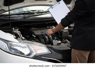 Car and engine service concept - Blurred car engine room checking maintenance service by mechanical and copy space, Use for car engine service content - Shutterstock ID 1576335967