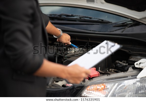 Car and engine service concept -\
Blurred car engine room checking maintenance service by mechanical\
and copy space, Use for car engine service\
content
