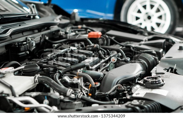 Car and engine service concpet - Blurred\
car engine room checking maintenance sevice by mechanical and copy\
space, Use for car engine service\
content