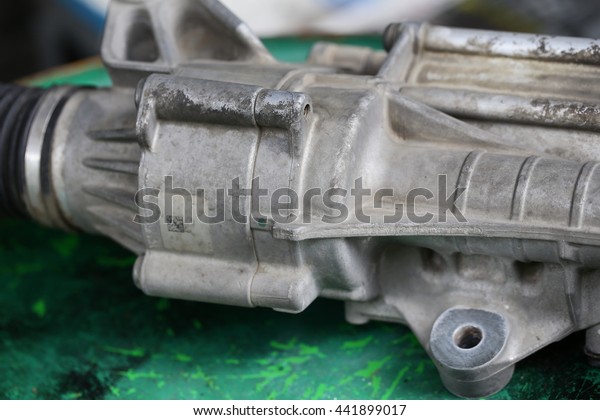 Car engine spare part in a\
garage