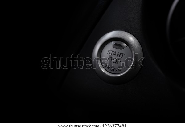 car engine star and stop button with\
soft-focus and over light in the\
background