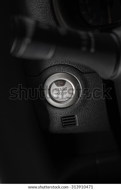 Car engine start button (close up Monochrome image
with dark and light)