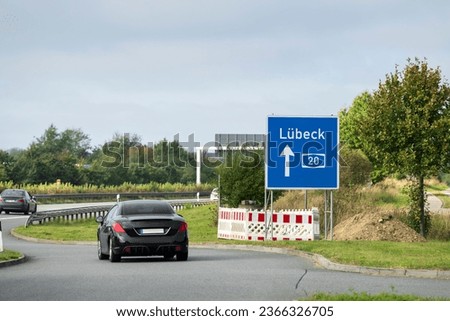 A car enters the highway from the rest area in the direction of Lübeck