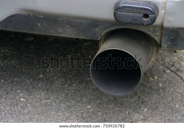 Car exhaust pipe., Close up intake exhaust under\
car vehicle.