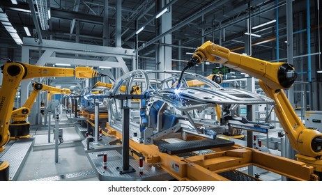 Car Factory 3D Concept: Automated Robot Arm Assembly Line Manufacturing High-Tech Green Energy Electric Vehicles. Automatic Construction, Building, Welding Industrial Production Conveyor. - Shutterstock ID 2075069899