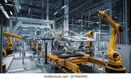 Car Factory 3D Concept: Automated Robot Arm Assembly Line Manufacturing High-Tech Green Energy Electric Vehicles. Automatic Construction, Building, Welding Industrial Production Conveyor. - Shutterstock ID 2075069902