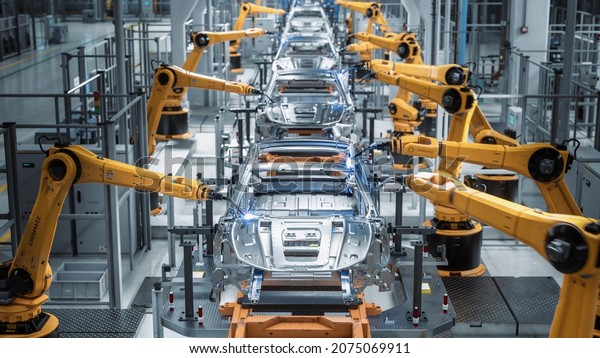 Car Factory 3D Concept: Automated Robot Arm Assembly\
Line Manufacturing High-Tech Green Energy Electric Vehicles.\
Automatic Construction, Building, Welding Industrial Production\
Conveyor. Front View