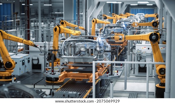 Car Factory 3D Concept: Automated Robot Arm Assembly\
Line Manufacturing Advanced High-Tech Green Energy Electric\
Vehicles. Construction, Building, Welding Industrial Production\
Conveyor. Back View