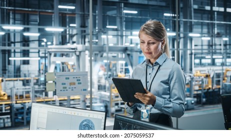 Car Factory Office Concept: Portrait Of Successful Female Chief Automotive Engineer Using Tablet Computer To Design And Optimize Automated Robot Arm Assembly Line Manufacturing Electric Vehicles