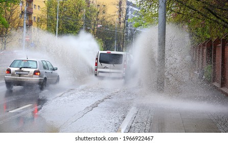 The Car Falls Into A Pool Of Water On The Road, Causing A Splash.