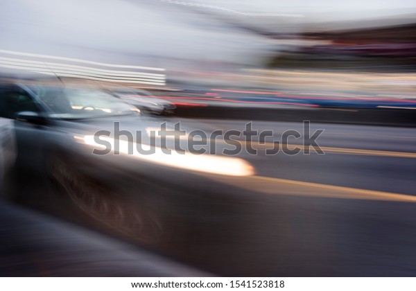 car\
in fast motion on a deliberately blurred\
background