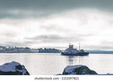 Car Ferry Crossing A Fjord Between Islands In Norway, Driven By Electricity