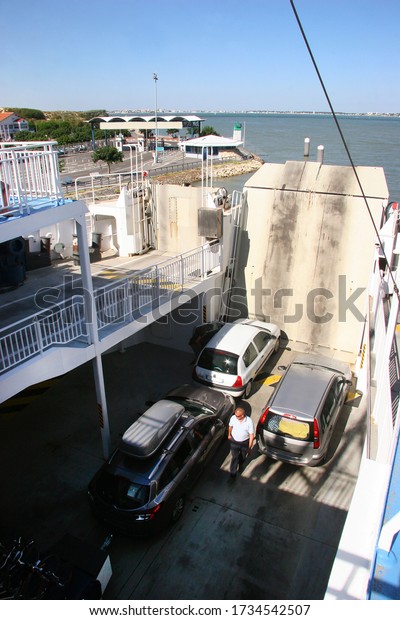 car ferry\
departing for a sea channel crossing\
