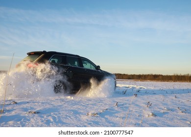 Car in the field winter. Off-road winter snow drifts. Extreme sport, entertainment.