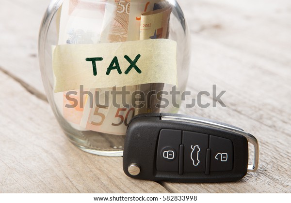 Car
finance concept - money glass with word Tex, car
key