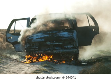 Car Fire On Desert Rural Road