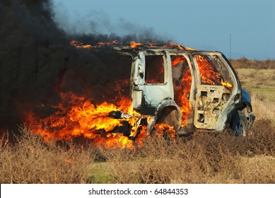 Car Fire On Desert Rural Road